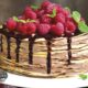 Pancake chocolate cake with fresh raspberry.